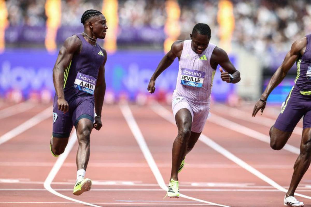 Nigerian sprinter Kayinsola Ajayi crossing finish line ahead of Jamaican competitor Oblique Seville at London Stadium