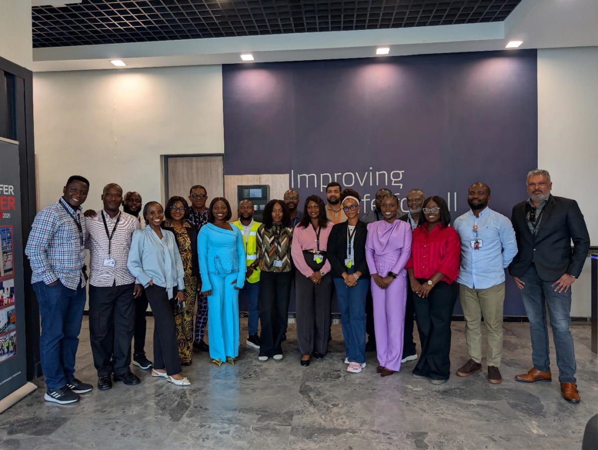 WACT-APM Terminals management team posing with six female graduates in professional attire