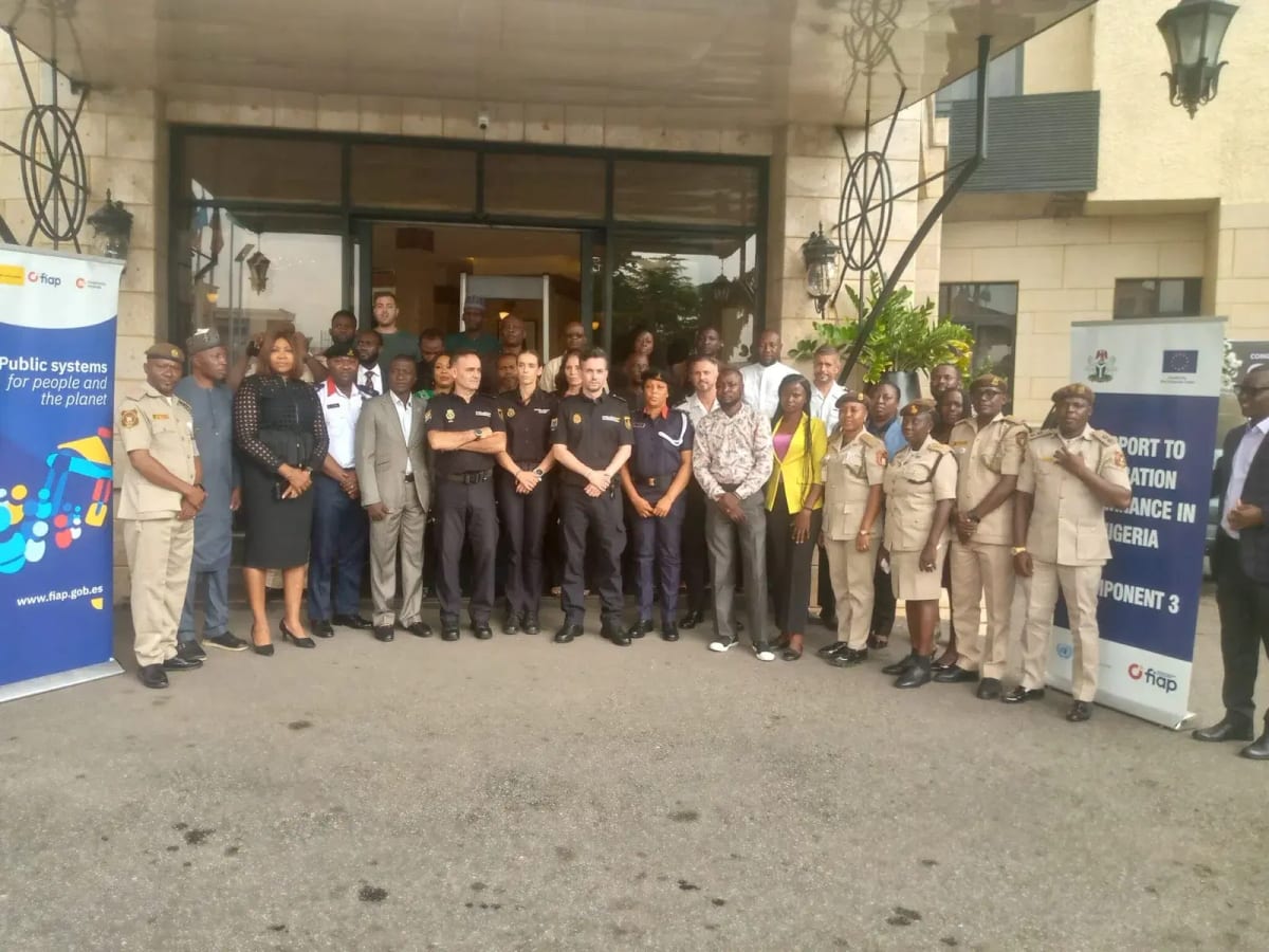 Nigerian and Spanish law enforcement officers collaborating at anti-trafficking training workshop in Abuja