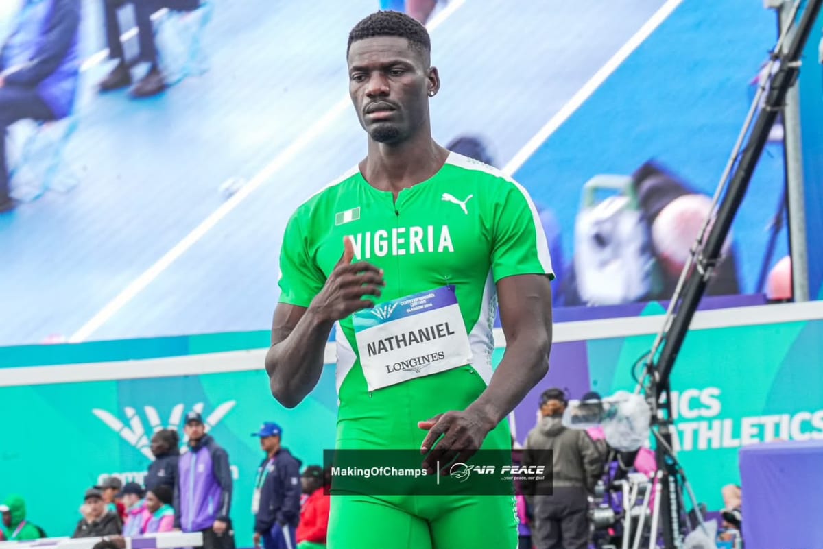 Nigerian police officer Corporal Ezekiel Nathaniel celebrating Commonwealth Games 400-meter hurdles gold medal victory