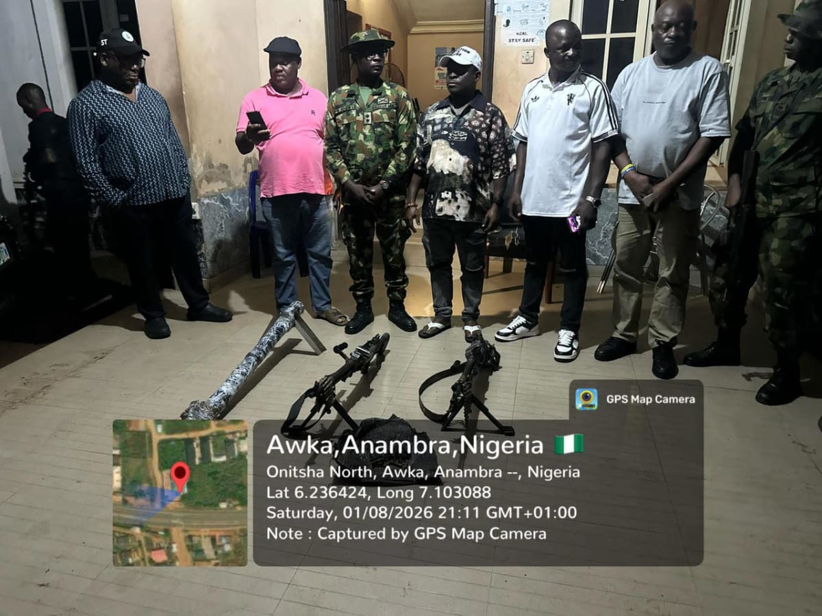 Nigerian military personnel display recovered weapons from surrendered militants in South-East operation