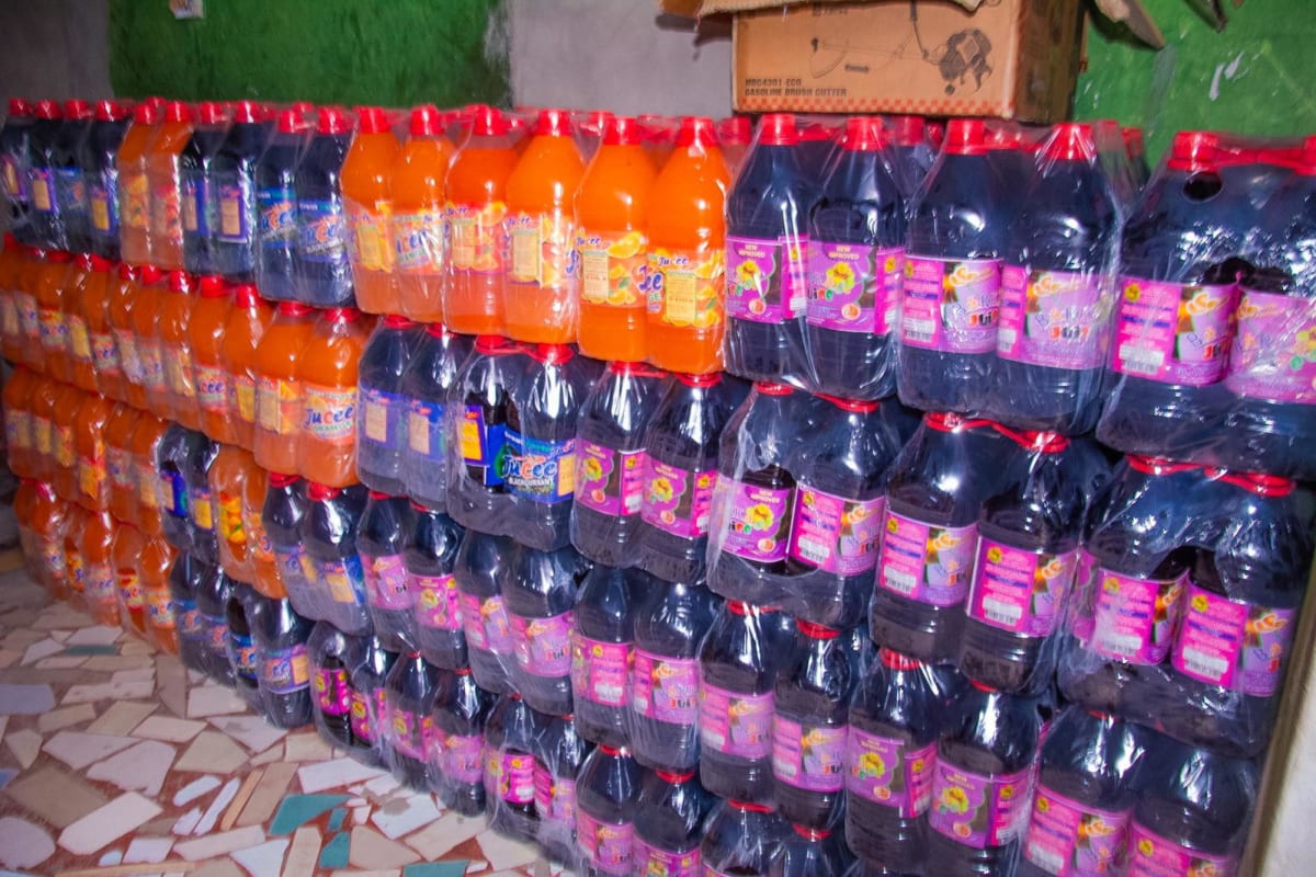 Nigerian security officials at closed factory site protecting community from unsafe products