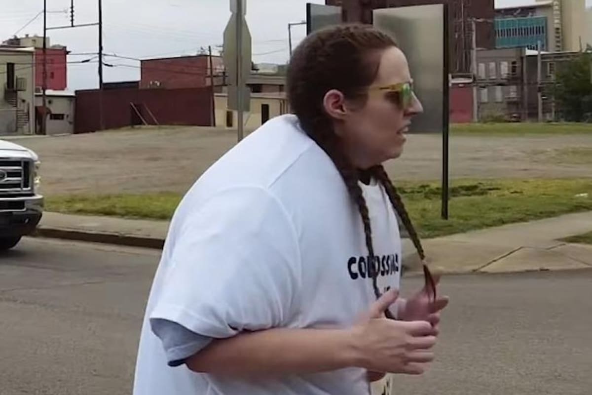 Arkansas runner Meredith Smith wearing 55 layered T-shirts during Fort Smith Half Marathon