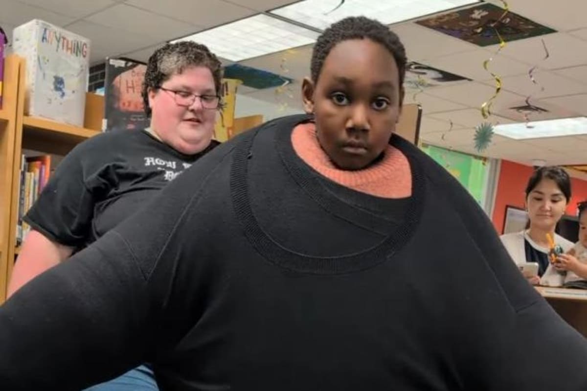 Seven-year-old boy wearing dozens of layered sweaters at public library for world record attempt