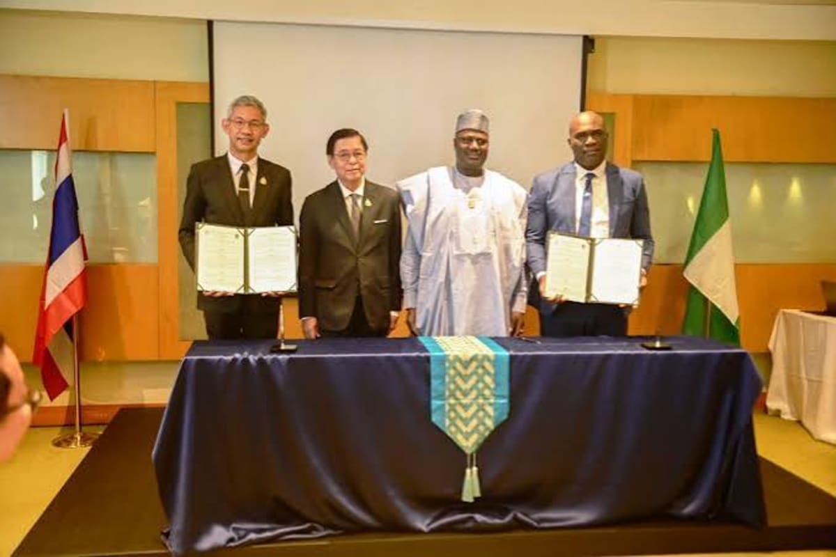 Nigerian and Thai officials shaking hands during historic agricultural partnership signing ceremony in Lagos