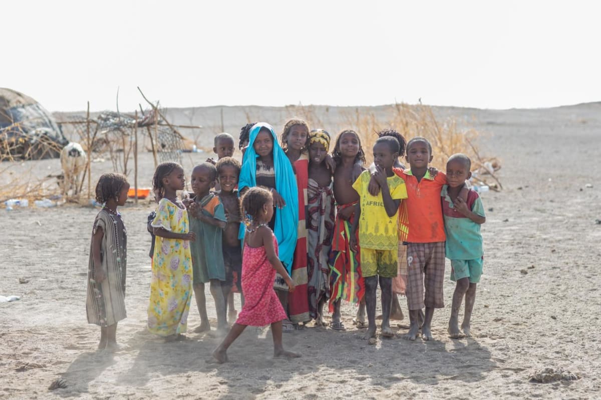 Children standing outside homes in Semera, Afar Region, Ethiopia, awaiting humanitarian assistance
