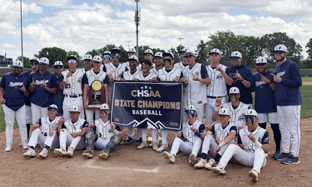 High school baseball pitcher Gage Viken celebrating championship victory with teammates on field