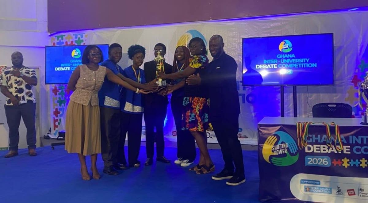 Four University of Ghana debate team members celebrating their championship victory at British Council Accra