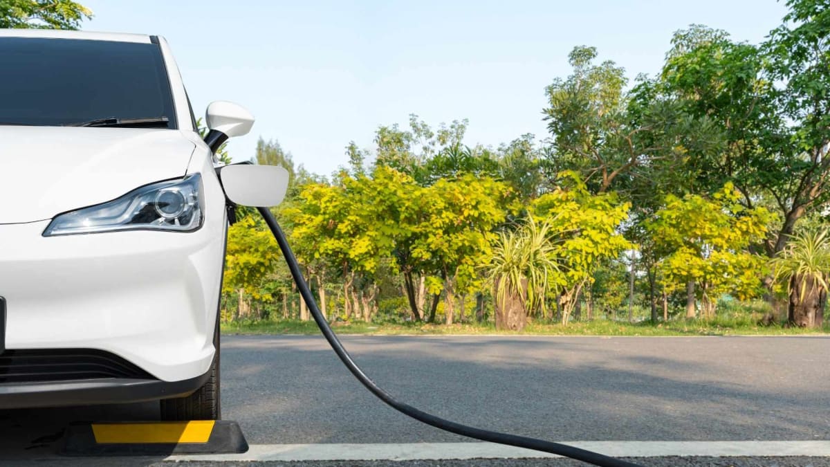 White electric vehicle charging at a municipal parking facility in Coral Gables, Florida