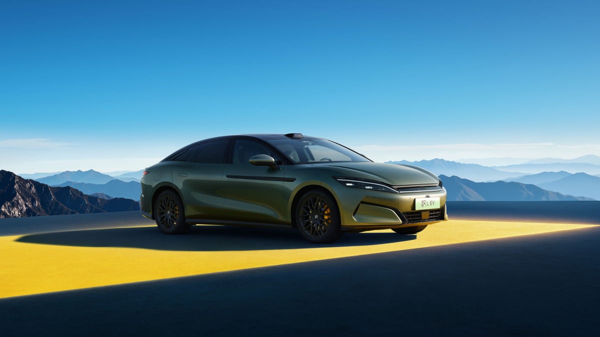 Modern white BYD electric vehicle charging station with sleek design and digital display