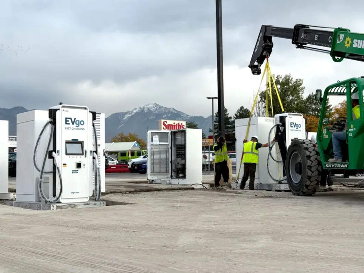 Modern electric vehicle fast charging station with multiple charging ports at retail location