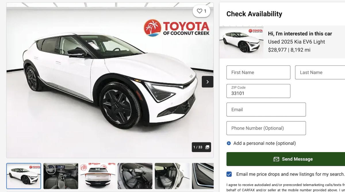 Row of modern electric vehicles at dealership lot ready for used car sales