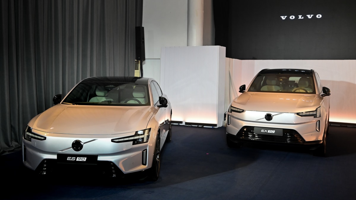 Journalists examining new Volvo electric vehicles at Manila launch event