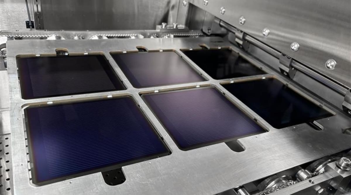 Modern solar panels being manufactured in bright factory showing advanced clean energy technology production