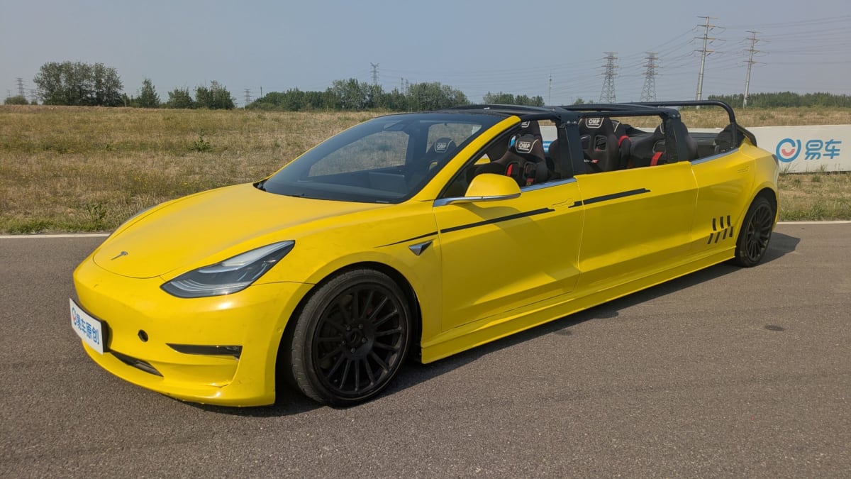 Stretched white Tesla Model 3 Performance drifting on racetrack in China with passengers
