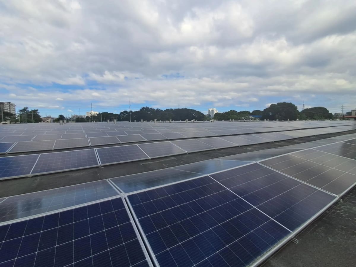 Rooftop solar panel array installed on building in Quezon City, Philippines
