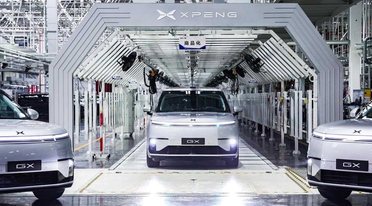 XPENG robotaxi autonomous electric vehicle on city street in Guangzhou, China
