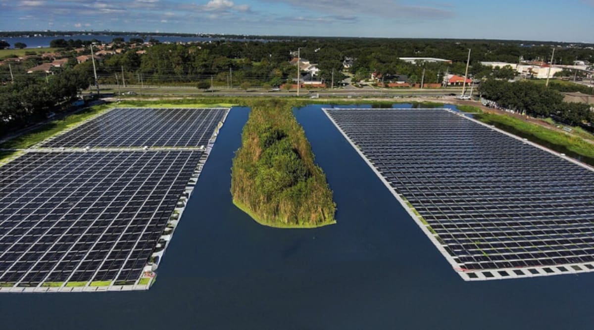 Floating solar panels installed on stormwater pond beside Florida highway generating clean energy