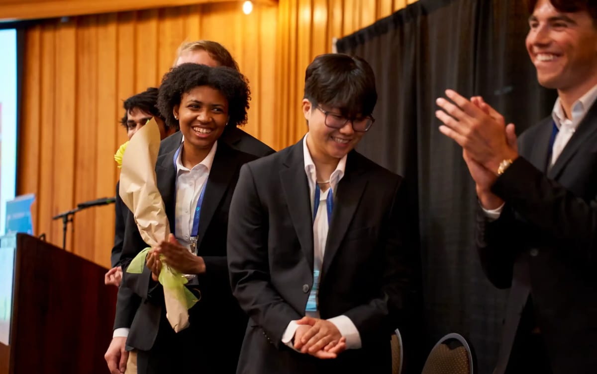 University of Southern California team members celebrating with awards after winning marine energy competition