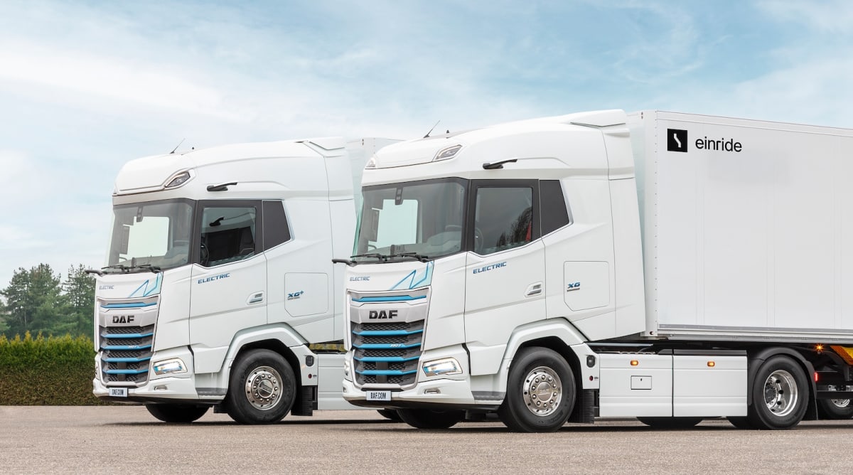 Modern white DAF electric freight truck on European highway demonstrating autonomous driving technology