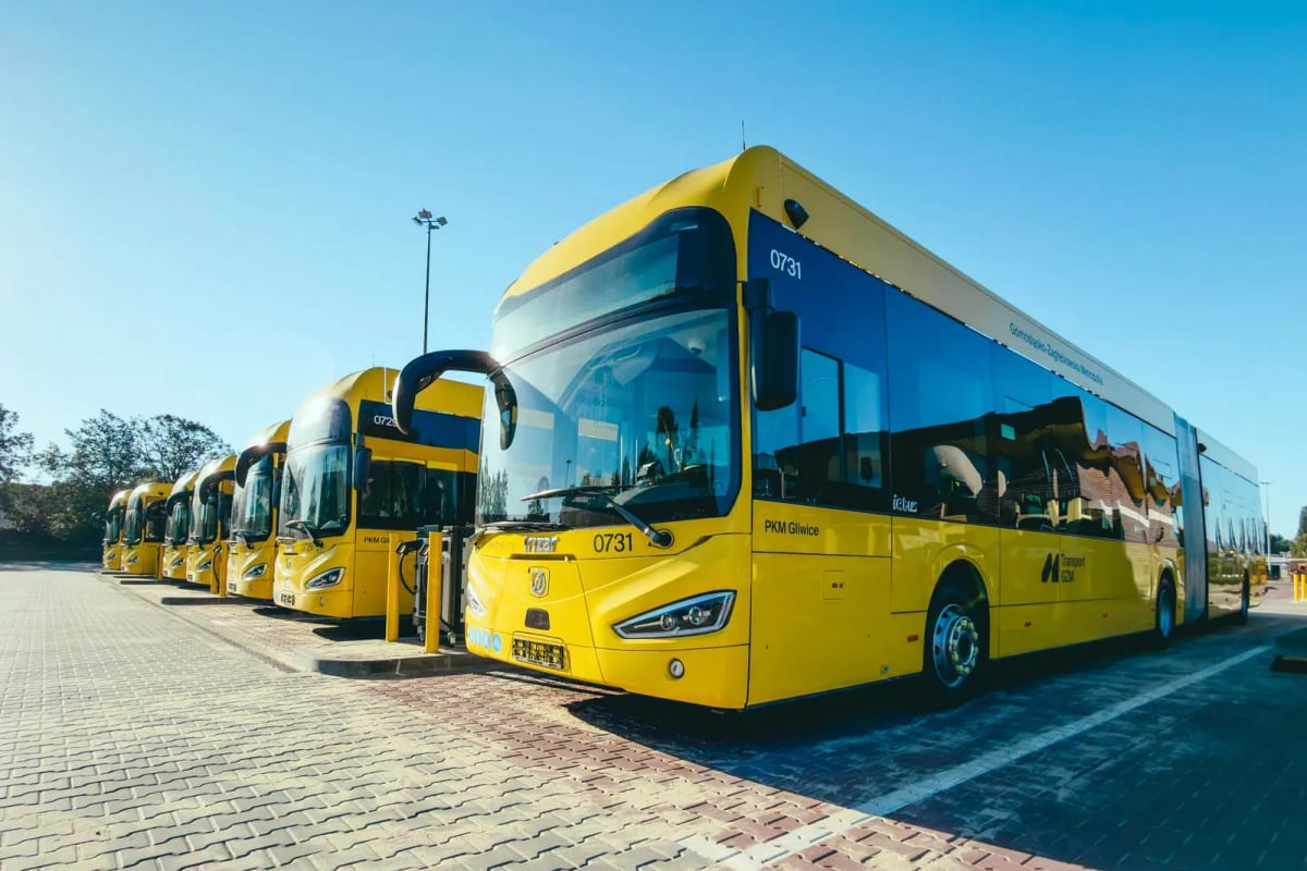 New white and blue Irizar electric buses lined up in Polish transit depot