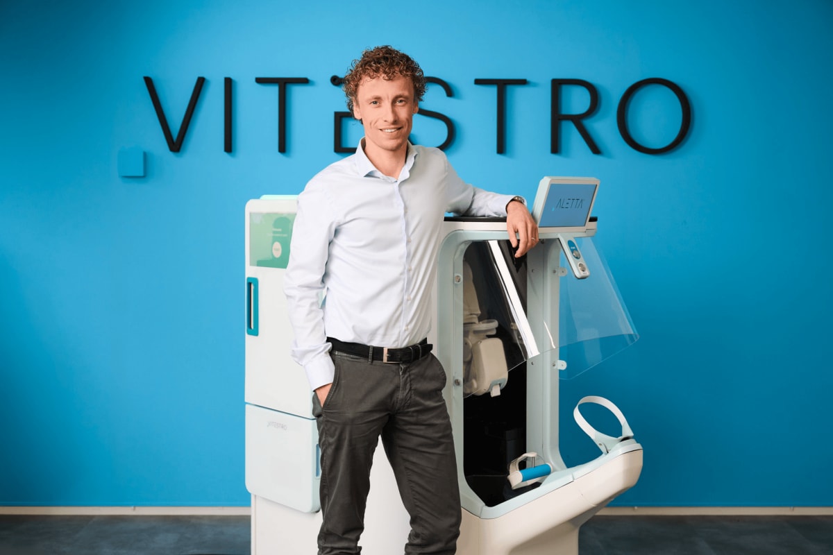 Aletta autonomous robotic phlebotomy system drawing blood from patient in clinical setting