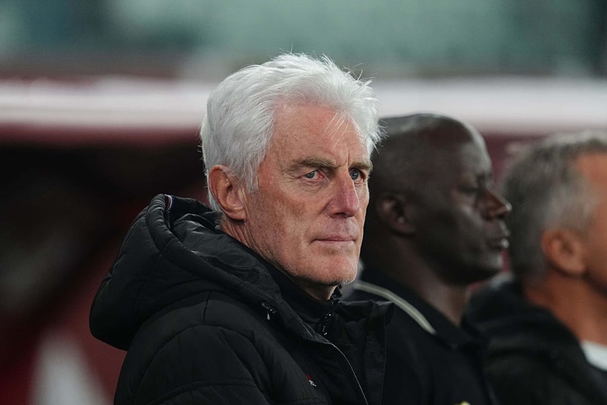 Hugo Broos coaching on sideline in South African national team gear