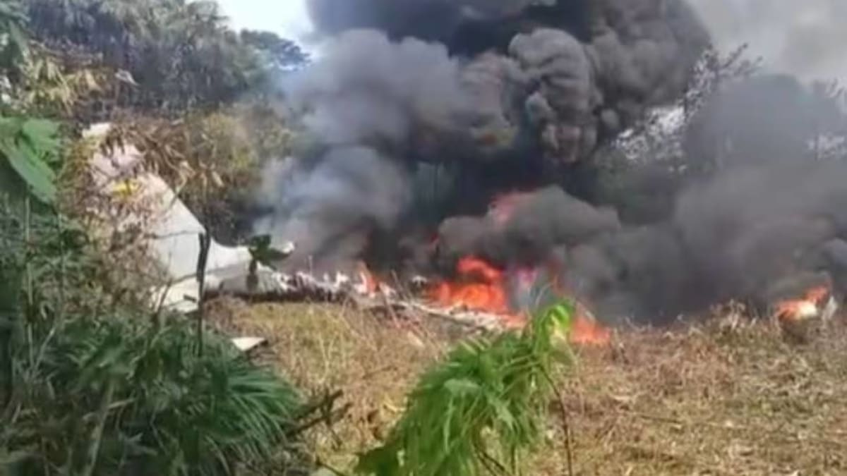 Emergency rescue teams working at military aircraft crash site in Colombian jungle