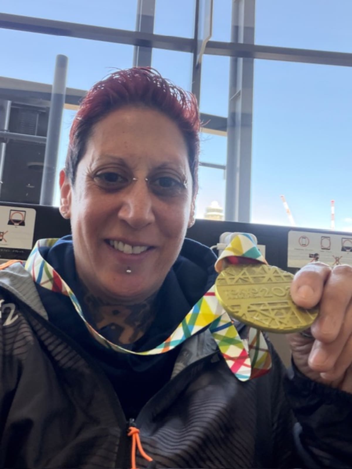 Runner Natasha Pollock at Tokyo Marathon finish line raising funds for street children's education