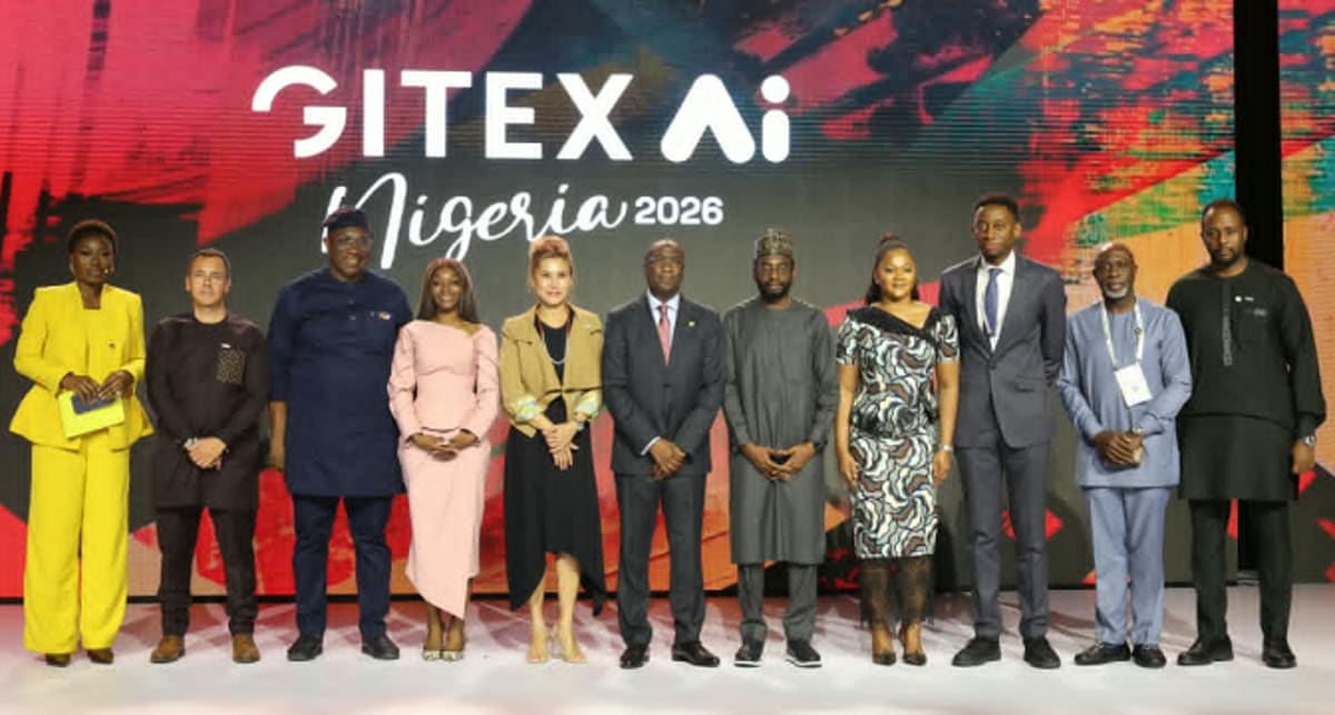 Crowded technology conference floor in Lagos with innovators discussing digital solutions and startups