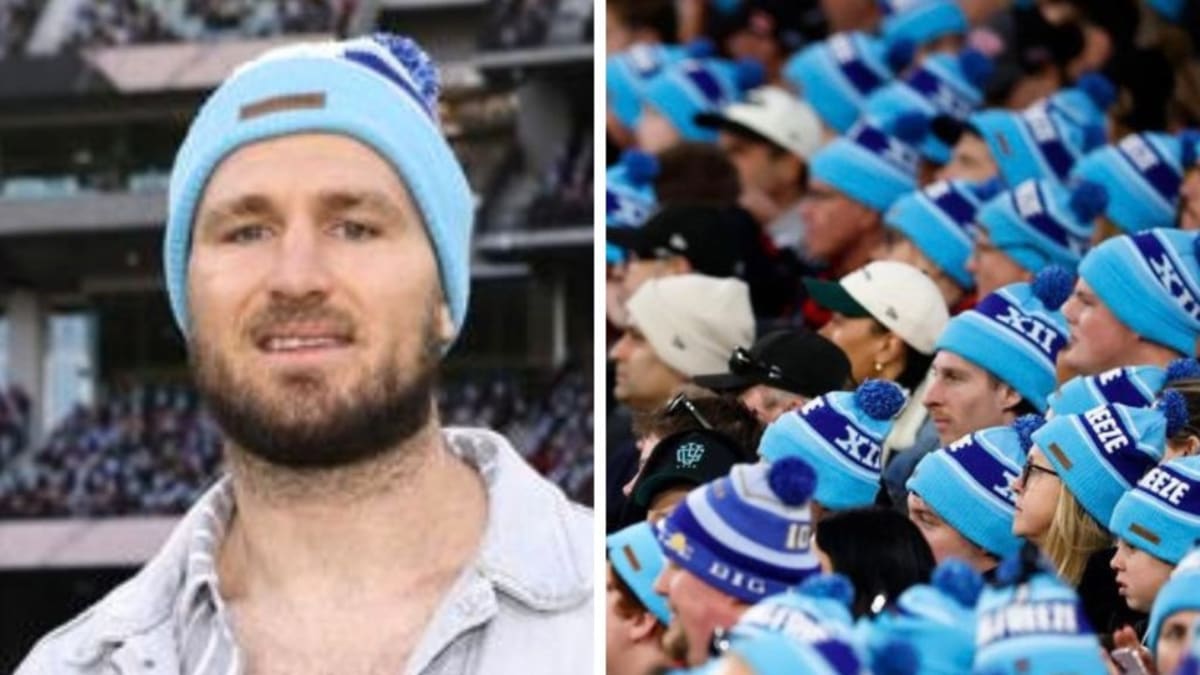 Crowd of AFL fans wearing blue Big Freeze beanies at Melbourne Cricket Ground charity event