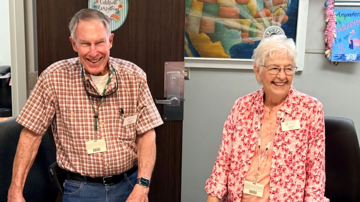 Couple Volunteers 20 Years at Tampa Airport Helping Travelers