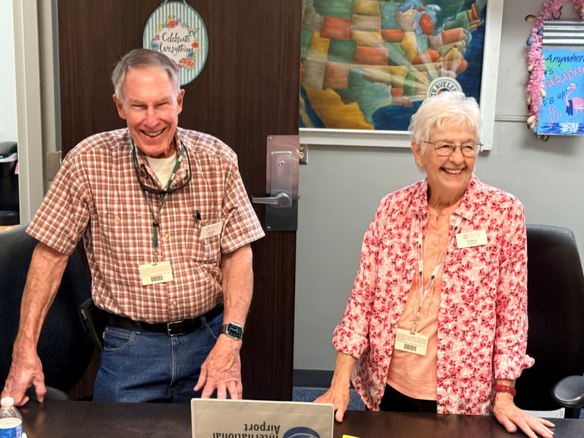 Couple Volunteers 20 Years at Tampa Airport Helping Travelers - Image 3