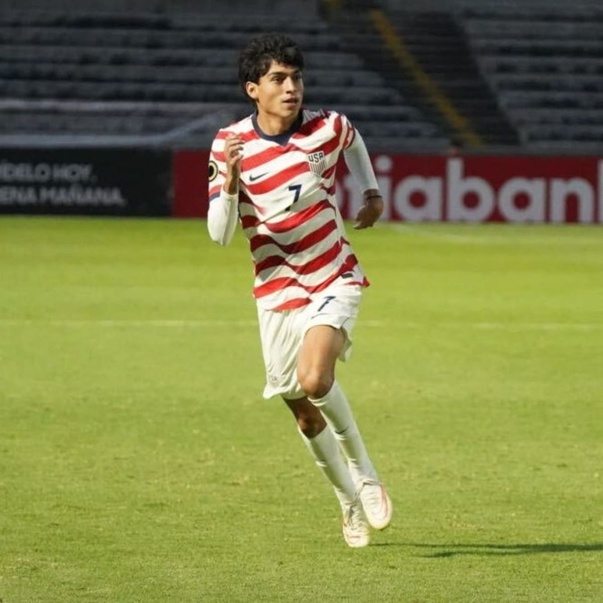 U.S. Under-19 soccer team celebrating comeback victory against Guatemala in championship quarterfinal match