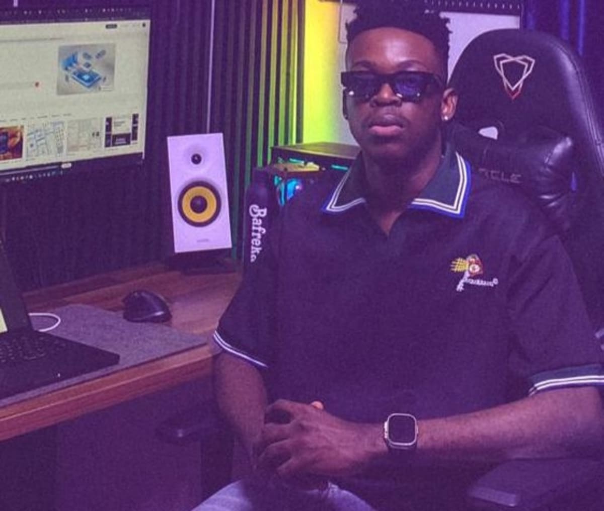 Nigerian product designer Babatunde Yusuf working on digital application design at computer