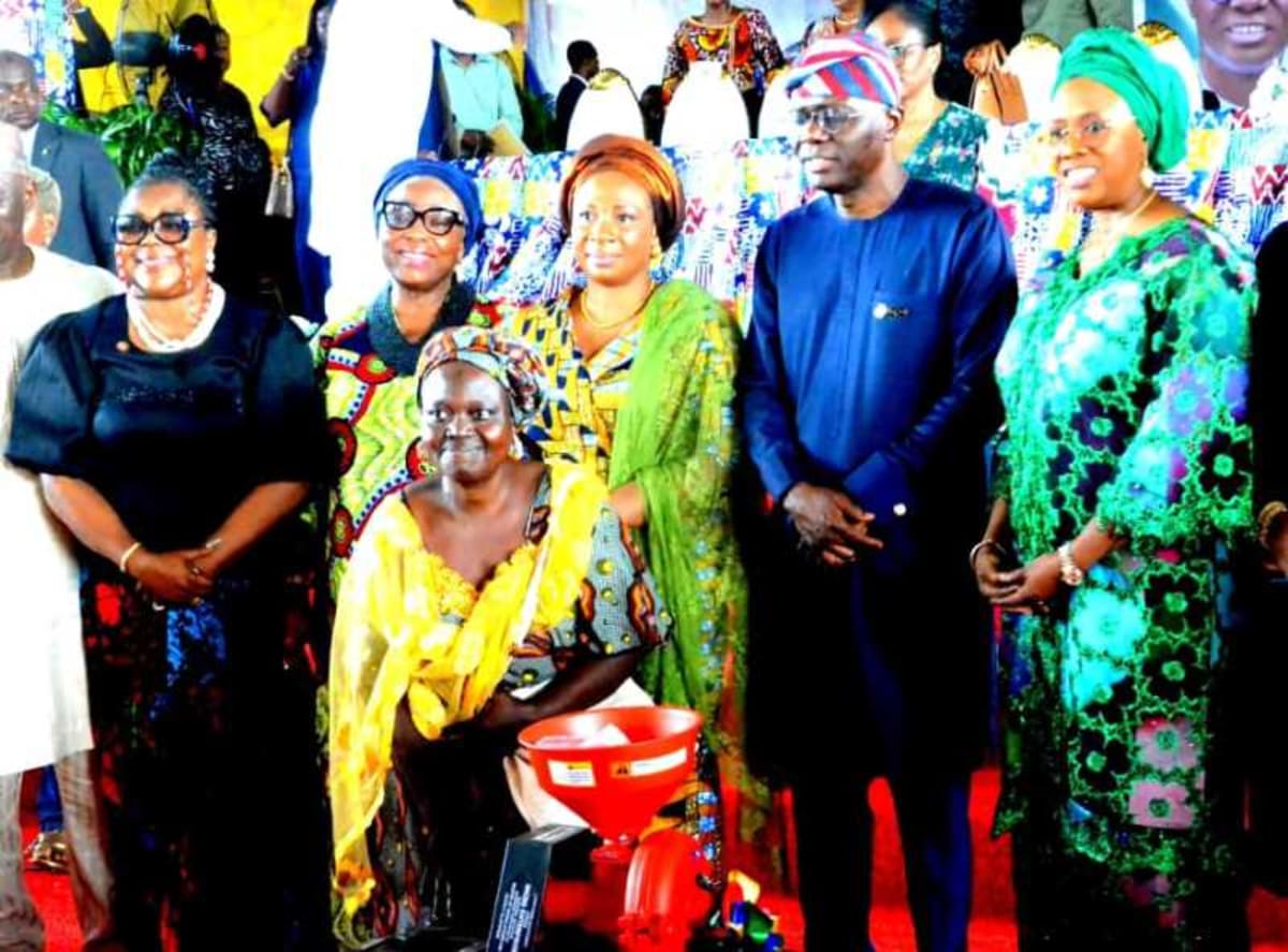 Lagos Governor presenting business equipment to program graduates at empowerment ceremony