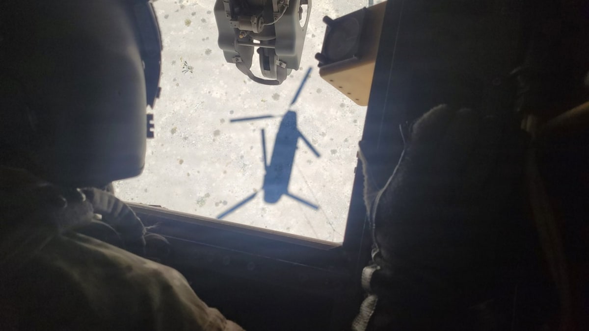 Nevada Army Guard Chinook helicopter preparing to lift F-35 aircraft parts in Mojave Desert