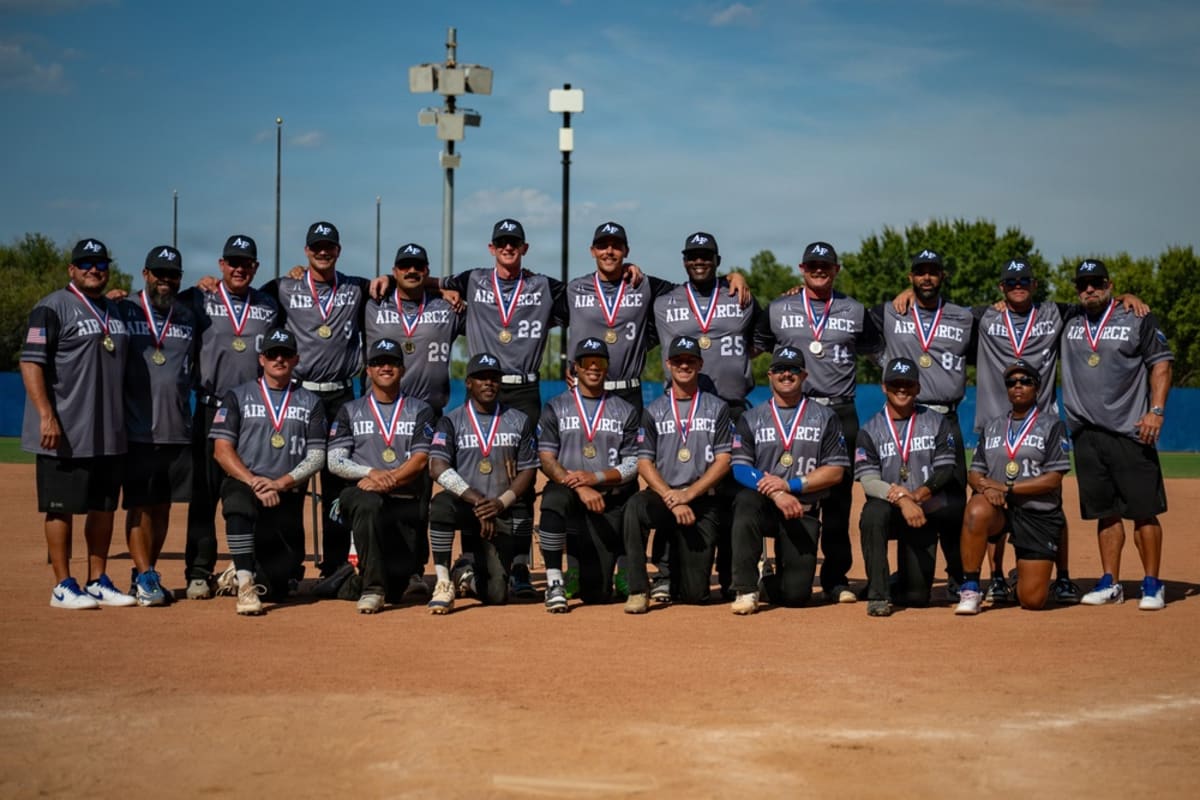 United States Air Force men's softball team posing together after winning championship in Oklahoma