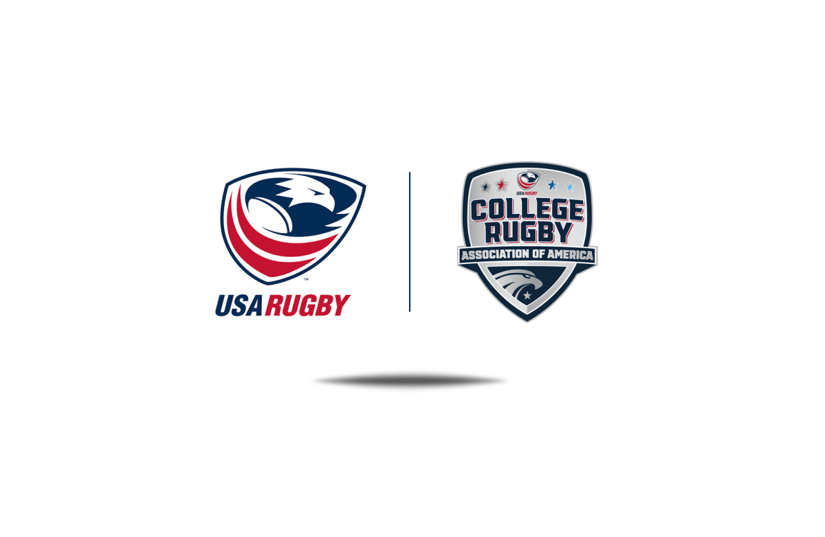 College rugby players in action during competitive match on grass field