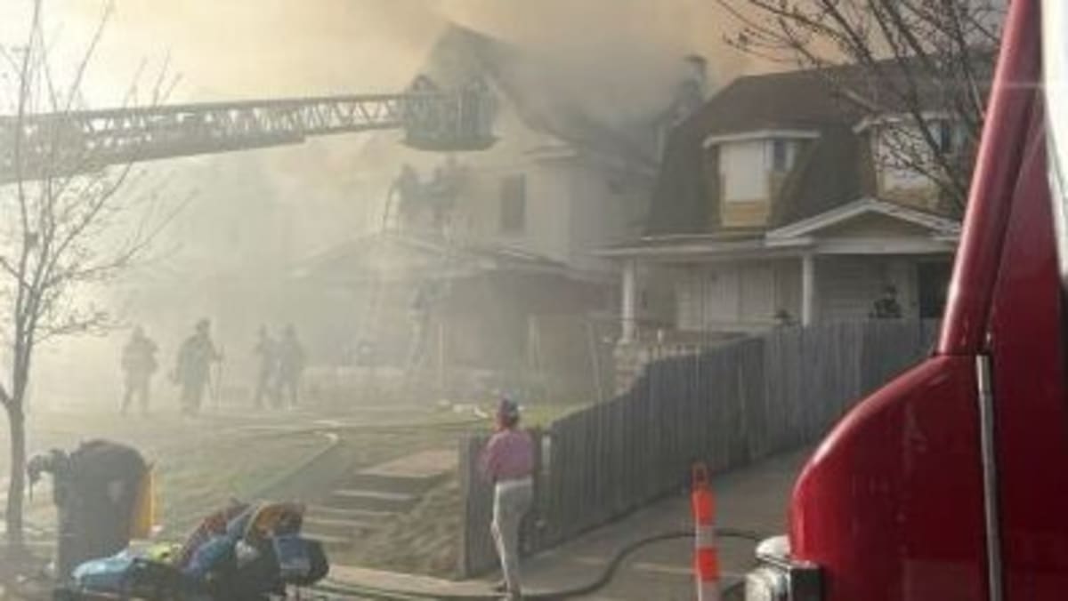 Kansas City firefighters battling house fire with multiple water lines deployed