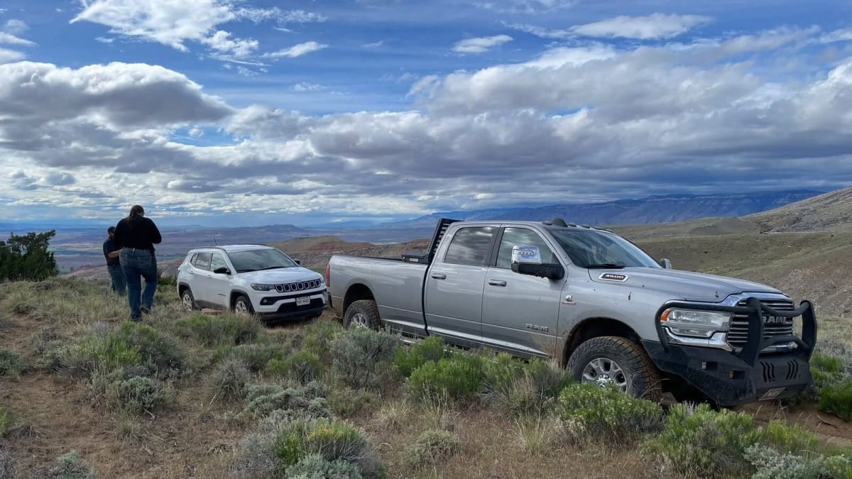 Search and rescue vehicle on rugged Wyoming mountain trail helping stranded tourists