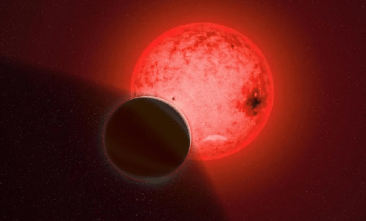 Artist rendering of giant exoplanet TOI-5205 b orbiting small red dwarf star