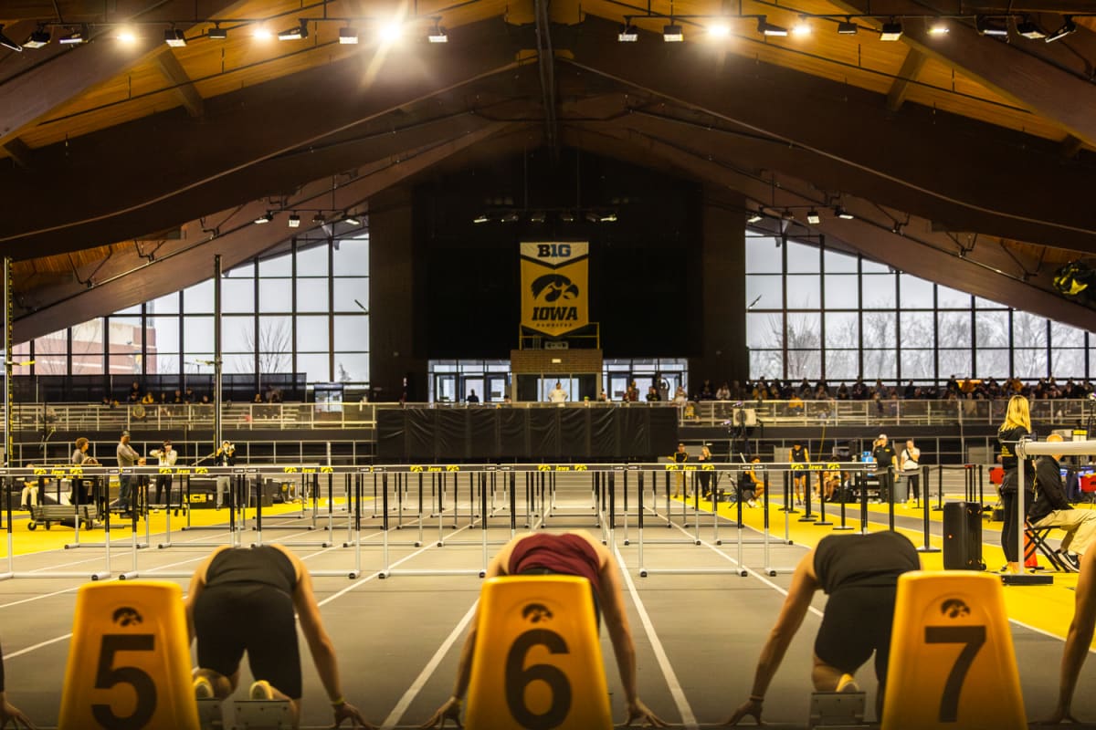 LED pacing lights illuminated along an indoor track during a college track and field meet