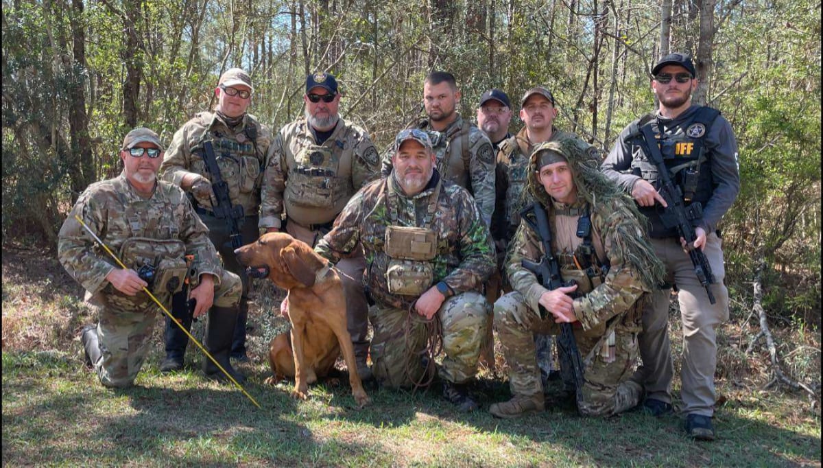 Amos the bloodhound with handler from Pearl River County Sheriff's Department in Mississippi