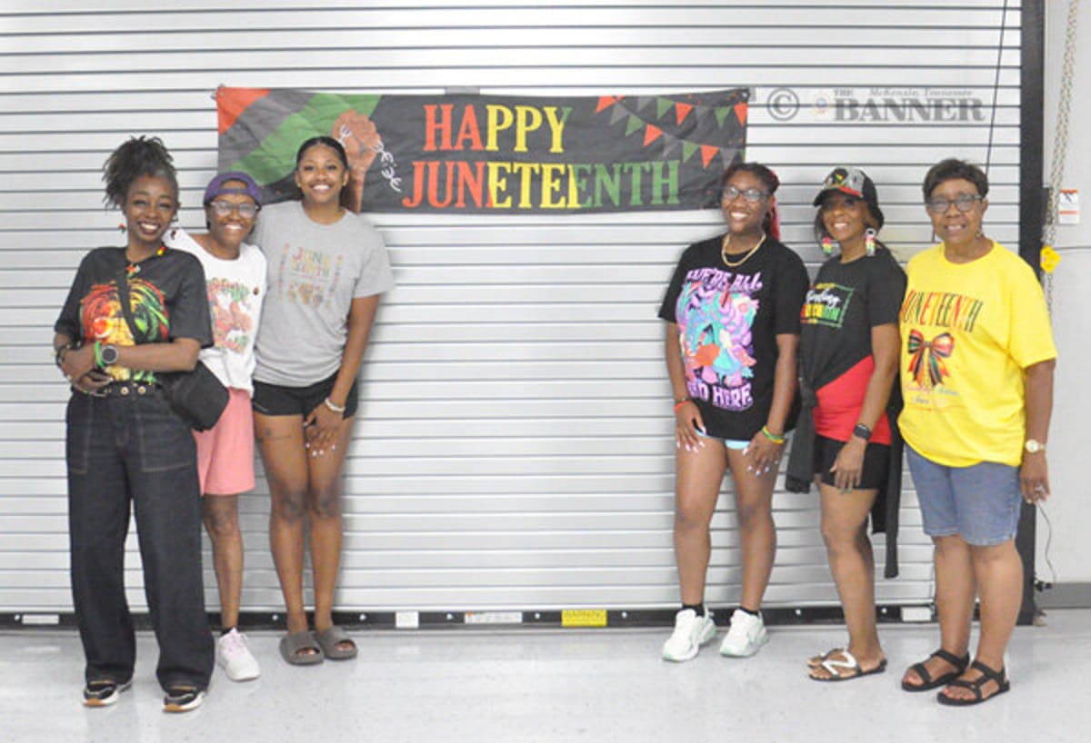 Community members gathering at Carroll County Juneteenth celebration with vendors and families enjoying festival activities together