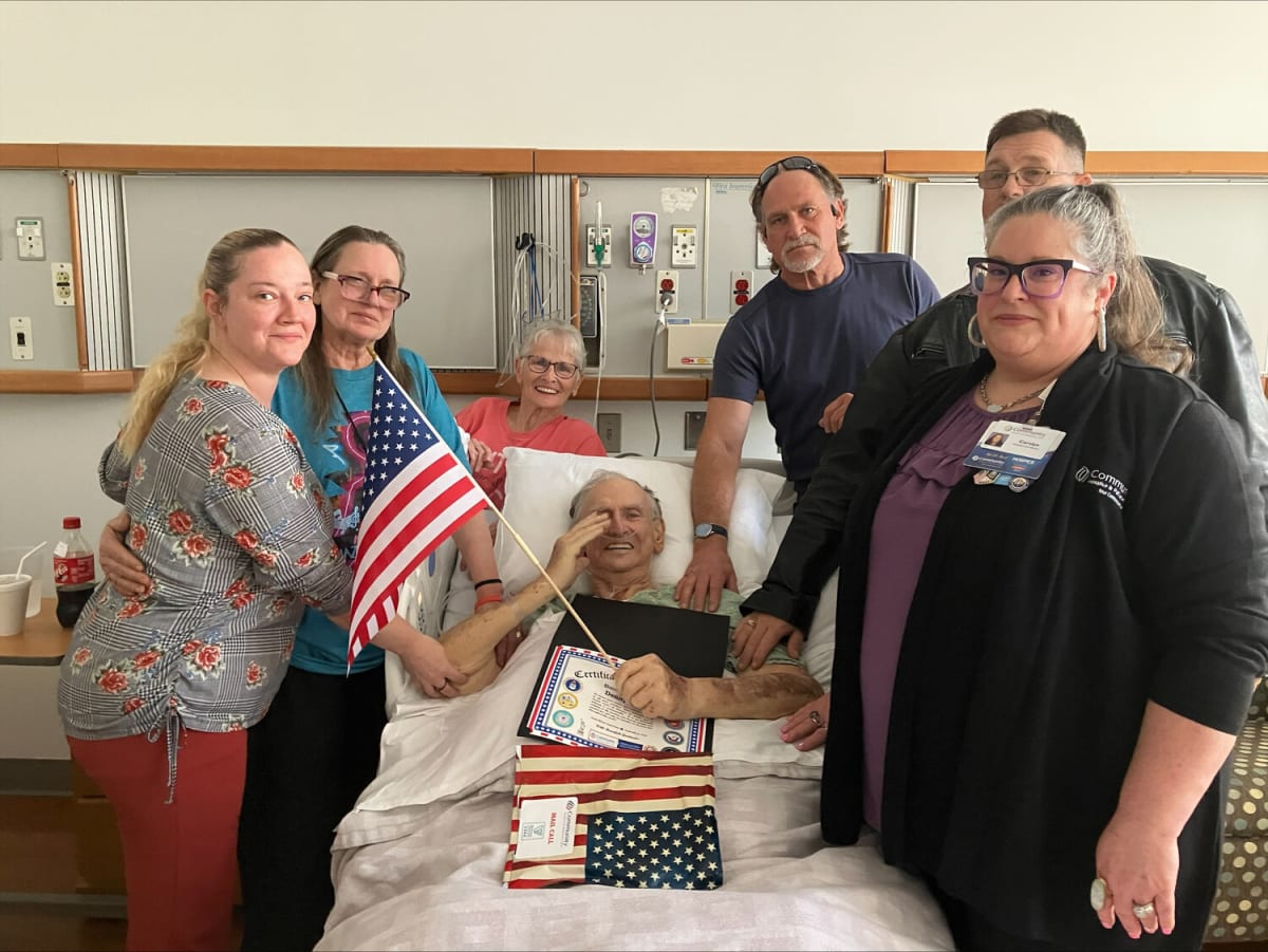 ** Veteran patient receiving supportive care and recognition from Community Hospice & Palliative Care staff
