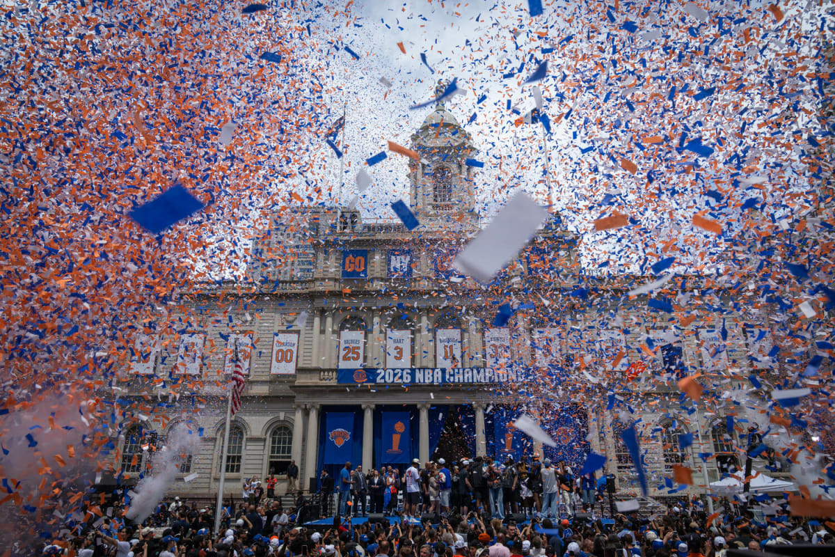 ** New York Knicks players greeting millions of celebrating fans during championship parade on Broadway