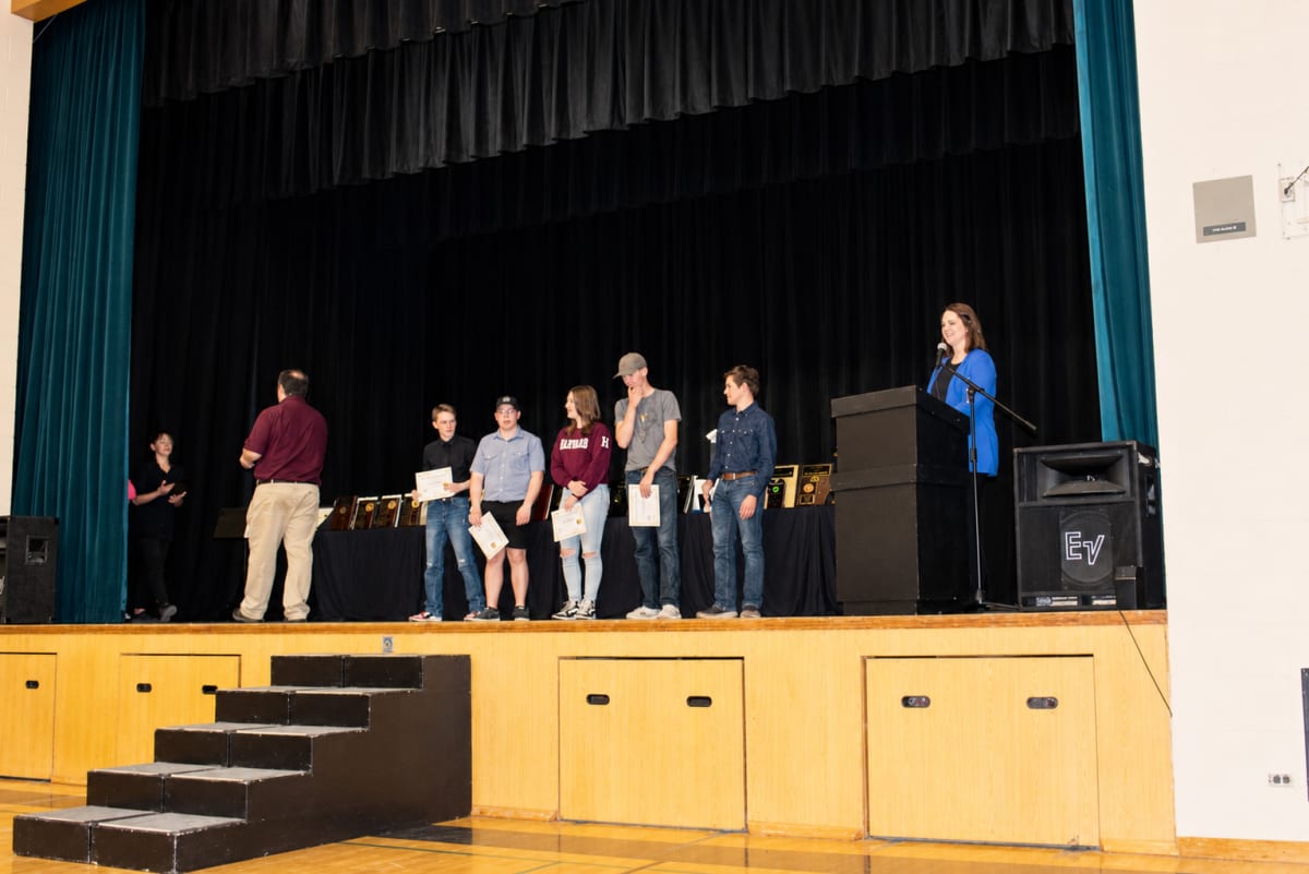 Students and families gather in school auditorium during Eaton School awards ceremony celebration