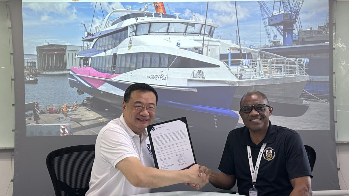Two modern white catamaran ferries docked at Bermuda's Hamilton ferry terminal