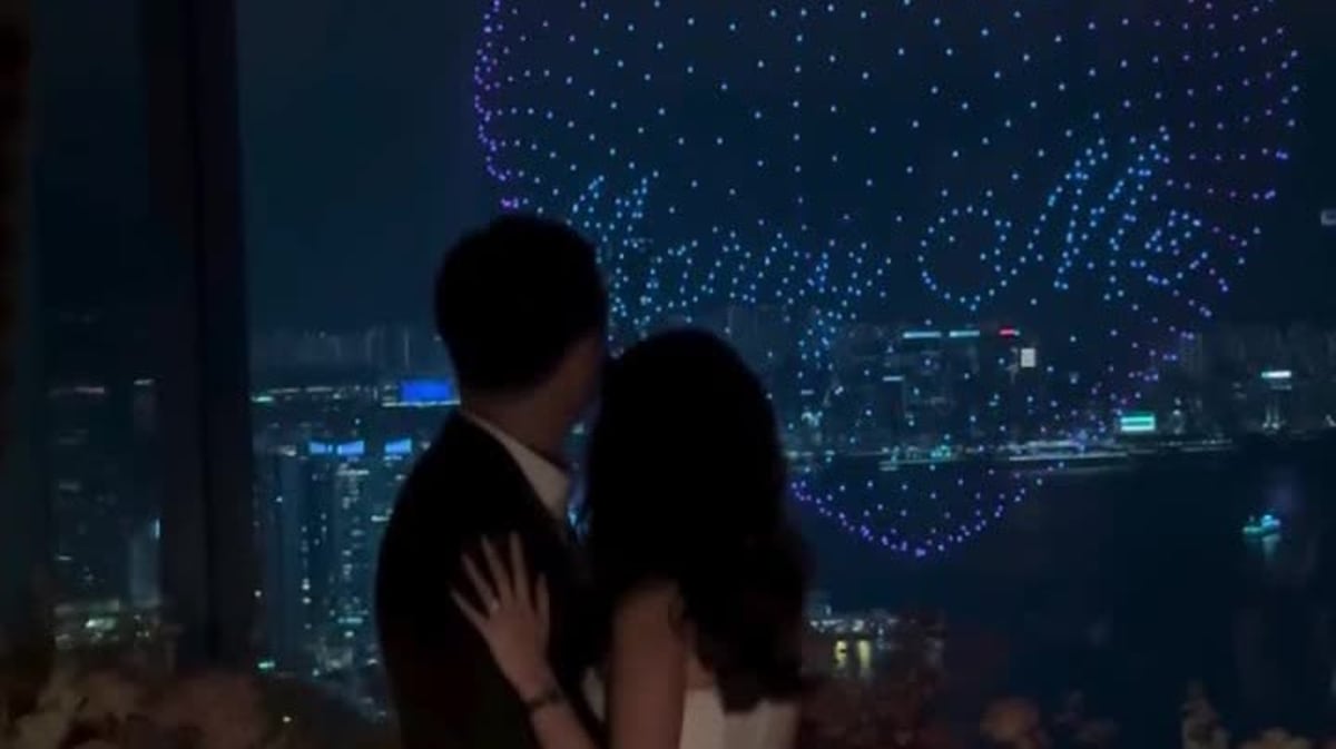 Drones forming "Marry Me" message in night sky above Hong Kong's Victoria Harbour waterfront